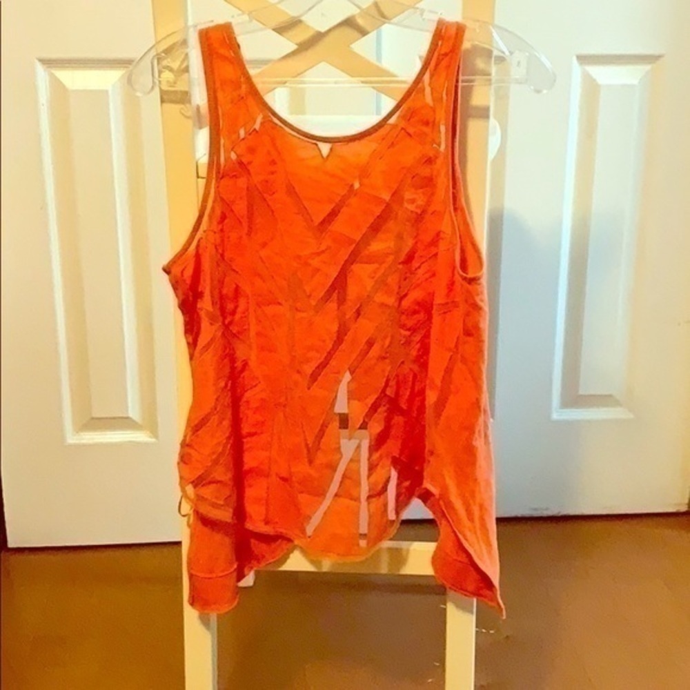 Free people Orange Asymmetrical tank size Medium